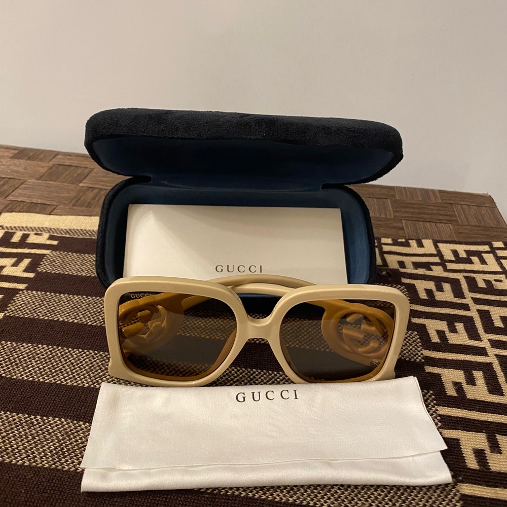 Gucci sunglasses. Never worn. Mint condition. Sold with the case.